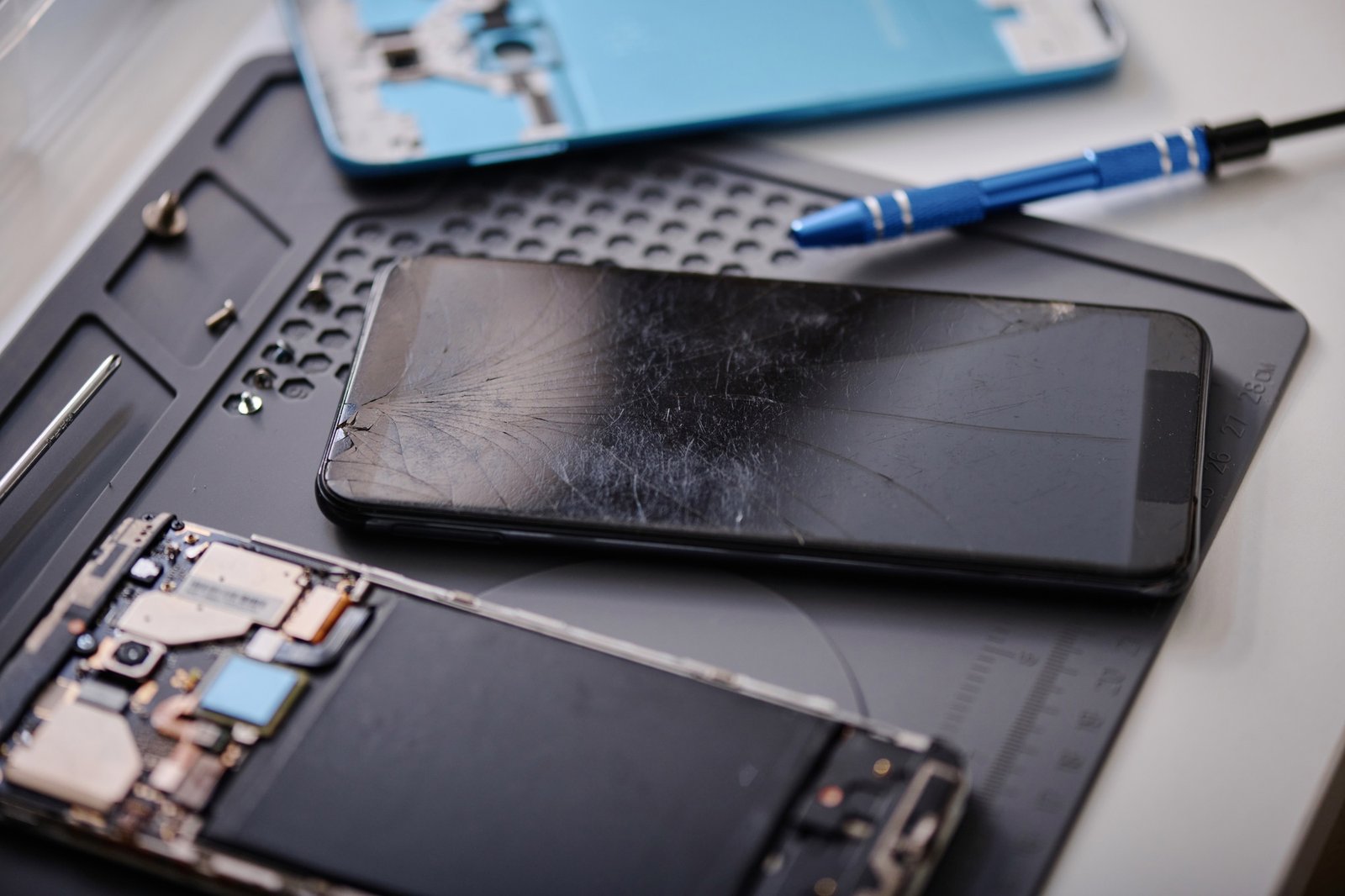 Damaged Mobile Phone with Cracked Glass Prepared for Repairing